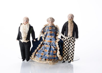 Lot 1541 - Three mid 19th century bisque shoulder-head dolls’ house elderly dolls