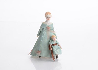 Lot 1547 - A small German bisque shoulder-head dolls’ house doll