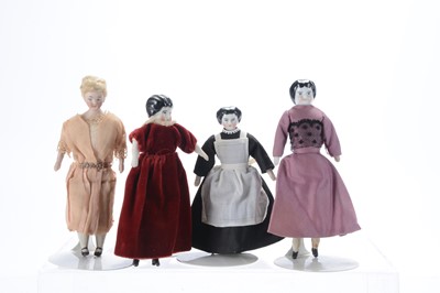 Lot 1562 - Four shoulder-head dolls’ house dolls