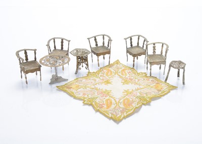 Lot 1566 - Five German soft-metal dolls’ house corner chairs