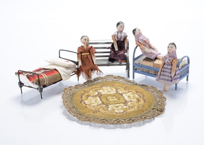 Lot 1568 - Four pegged wooden dolls’ house dolls
