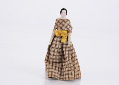 Lot 1583 - A mid 19th century china shoulder-head dolls’ house doll