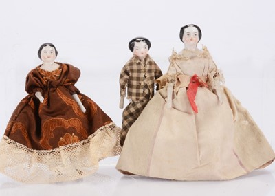 Lot 1584 - Three 19th century china shoulder-head dolls’ house dolls