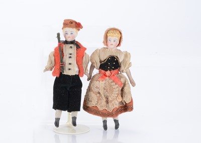Lot 1586 - A 19th century bisque shoulder-head dolls’ house couple