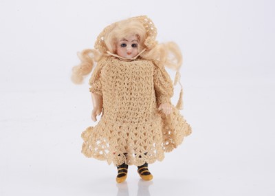 Lot 1590 - A German bisque headed dolls’ house doll