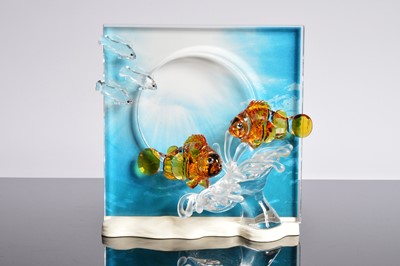 Lot 57 - A Swarovski Orange colored Clownfish over a frosted sea anemone