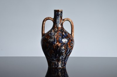 Lot 113 - A late 19th or early 20th century Della Robbia Pottery twin handledbottle vase by Carrie Ann Walker
