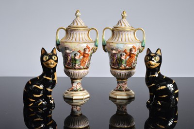 Lot 157 - A pair early 20th century Capodimonte pottery covered vases and a later pair of pottery pussy cats