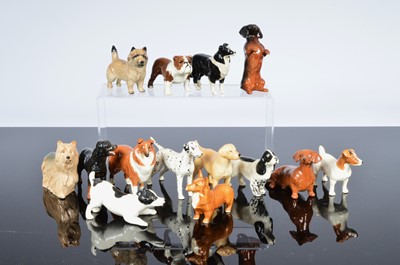 Lot 255 - A collection of thirteen small Beswick dogs