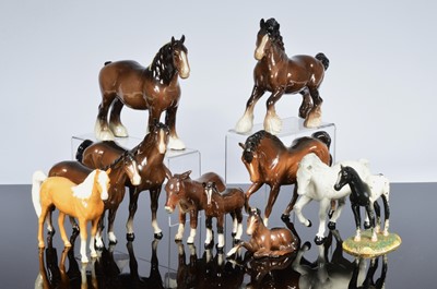 Lot 259 - A collection of eleven Beswick and Royal Doulton horses