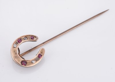 Lot 28 - A 19th Century ruby and diamond horseshoe stick pin