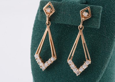 Lot 150 - A pair of yellow metal and diamond set chevron shaped earrings
