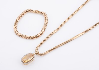 Lot 155 - A Citrine and diamond cluster pendant on a chevron link necklace