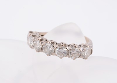 Lot 176 - An 18ct gold diamond half hoop eternity ring
