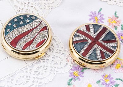 Lot 261 - Two contemporary Estee Lauder circular compacts