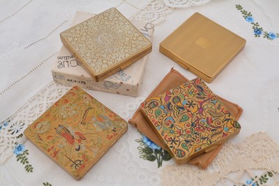 Lot 337 - Four square Vogue Vanities gilt metal compacts