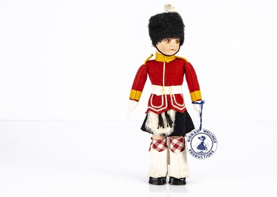 Lot 1145 - A post-war Norah Wellings Mascot Scotsguard doll