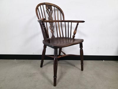 Lot 705 - An antique mixed wood Windsor style chair