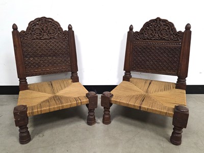 Lot 724 - A pair of second half 20th century Far Eastern hardwood low chairs
