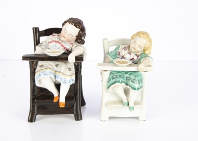 Lot 1372 - Two late 19th century Continental porcelain dozing child trinket boxes
