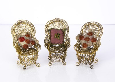 Lot 1400 - Three late 19th century doll’s gilt wire elaborate garden chairs