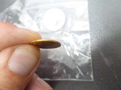 Lot 97 - A small gold coin from Thailand