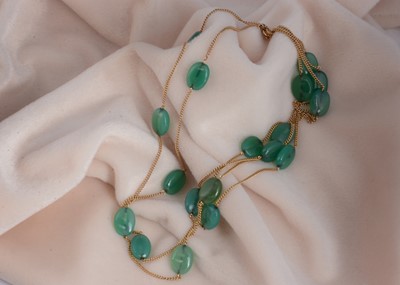 Lot 55 - A gold and chalcedony three strand necklace