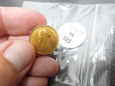 Lot 98 - A small gold coin from Tibet