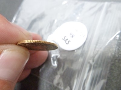 Lot 98 - A small gold coin from Tibet