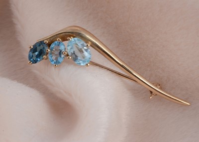Lot 110 - A 9ct gold and topaz bar brooch