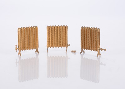 Lot 164 - Three German cast-lead dolls’ house radiators