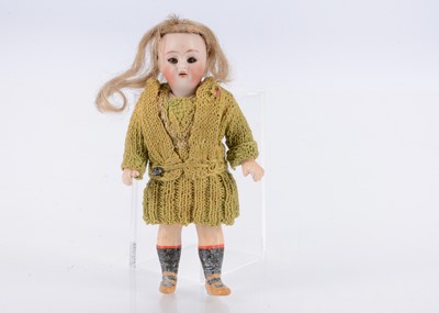 Lot 646 - A small Simon & Halbig for Kammer & Reinhardt child doll