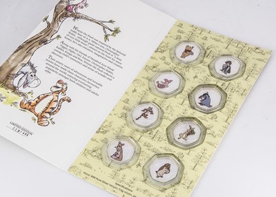 Lot 203 - A set of eight Disney Winnie the Pooh Silver medallions