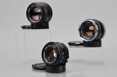 Lot 274 - Three Canon FD 50mm Lenses