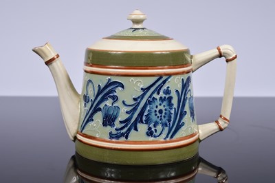 Lot 90 - A late 19th or very early 20th century McIntyre Pottery teapot
