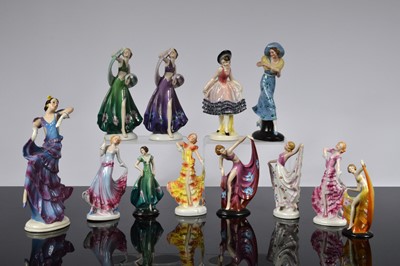 Lot 179 - A collection of twelve continental art deco style ceramic dancing female figurines