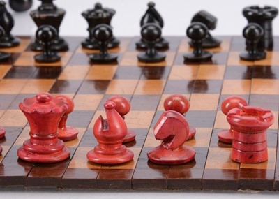 Lot 141 - A small turned wooden chess set