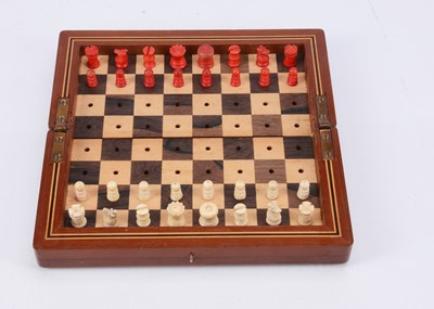 Lot 142 - An early 20th century traveling chess set