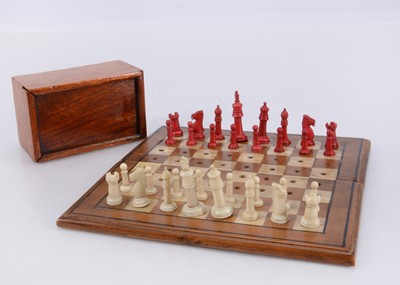 Lot 147 - A late 19th century travelling bone chess set