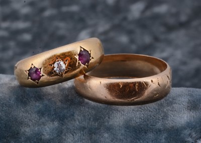Lot 15 - A Victorian three stone ruby and diamond 18ct gold dress ring