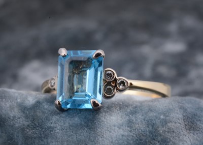 Lot 55 - An 18ct gold continental topaz and diamond dress ring