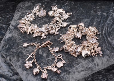 Lot 57 - Three silver charm bracelets