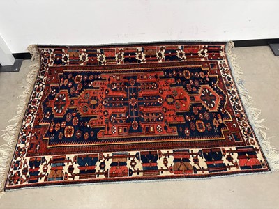 Lot 501 - A vintage Iranian woollen carpet