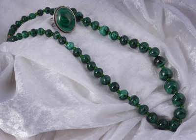 Lot 204 - A silver malachite dress ring