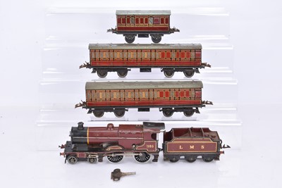 Lot 180 - Hornby 0 Gauge clockwork LMS maroon No 2 Special 4-4-0 Compound 1185 Locomotive and Tender and Suburban Coaches