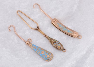 Lot 263 - Three blue enamel and yellow metal button loops and hooks