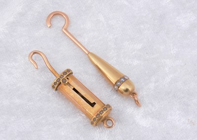 Lot 272 - A 19th Century yellow metal and seed pearl decorated sliding button hook