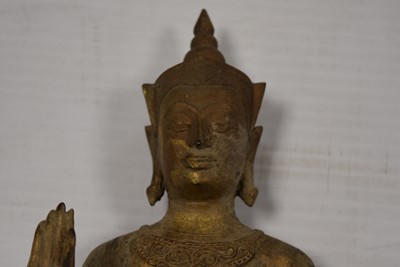 Lot 25 - A bronzed cast metal figure of a Standing Crowned Buddha in Abhayamundra