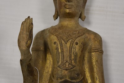 Lot 25 - A bronzed cast metal figure of a Standing Crowned Buddha in Abhayamundra