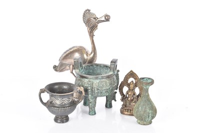 Lot 391 - A bronze three legged vessel